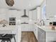 Bright kitchen boasts an island with bar stools, stainless appliances, and natural lighting at 6012 Millbridge Pkwy, Waxhaw, NC 28173