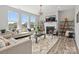 Bright living room with modern decor, fireplace, and ample natural light at 6012 Millbridge Pkwy, Waxhaw, NC 28173