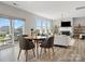 Spacious living room with an open floor plan, fireplace, and access to outdoor patio, perfect for entertaining at 6012 Millbridge Pkwy, Waxhaw, NC 28173