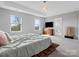Serene main bedroom with abundant natural light, platform bed, and modern decor at 6012 Millbridge Pkwy, Waxhaw, NC 28173