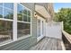 A charming back deck with white lattice and double doors, perfect for outdoor enjoyment at 6315 Prosperity Church Rd, Charlotte, NC 28269