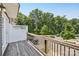 Private wooden deck with views of lush greenery, providing an ideal spot for relaxation or outdoor dining at 6315 Prosperity Church Rd, Charlotte, NC 28269