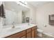 Bright bathroom features a double sink vanity, large mirror, and a separate shower area at 6315 Prosperity Church Rd, Charlotte, NC 28269