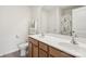 Well-lit bathroom featuring double sinks, a large mirror, and a charming dog-themed shower curtain at 6315 Prosperity Church Rd, Charlotte, NC 28269
