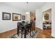 Inviting dining room with a table for four, wood floors and decorative wall art at 6315 Prosperity Church Rd, Charlotte, NC 28269