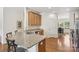 Kitchen island boasts granite countertops, stainless steel appliances, and sleek hardwood floors at 6315 Prosperity Church Rd, Charlotte, NC 28269