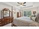 Spacious main bedroom boasts a tray ceiling, large windows, and elegant furniture, creating a serene retreat at 6315 Prosperity Church Rd, Charlotte, NC 28269
