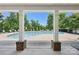 Community pool surrounded by lounge chairs and lush greenery, offering a relaxing oasis for residents at 6315 Prosperity Church Rd, Charlotte, NC 28269