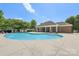 Sparkling pool with a brick clubhouse, perfect for outdoor relaxation and community gatherings at 6315 Prosperity Church Rd, Charlotte, NC 28269