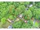 An aerial view shows the home surrounded by lush trees, featuring a spacious yard outlined in red at 6624 Lancer Dr, Charlotte, NC 28226