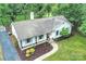 Aerial shot of a well-maintained home, showcasing its roof, landscaping, and driveway at 6624 Lancer Dr, Charlotte, NC 28226