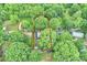 Aerial view showing a home nestled among lush trees with a large, outlined yard at 6624 Lancer Dr, Charlotte, NC 28226