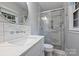 Modern bathroom featuring a glass-enclosed shower and stylish fixtures at 6624 Lancer Dr, Charlotte, NC 28226