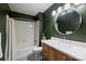 This bathroom features a vanity with new countertop and a shower-tub combo at 6624 Lancer Dr, Charlotte, NC 28226