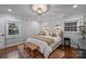Cozy bedroom featuring a comfortable bed, natural light, and stylish decor at 6624 Lancer Dr, Charlotte, NC 28226