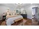 Comfortable bedroom featuring sconces and natural light at 6624 Lancer Dr, Charlotte, NC 28226