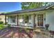 Inviting front entrance featuring gray shutters, dark wood columns, and stylish landscaping at 6624 Lancer Dr, Charlotte, NC 28226