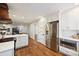 Bright kitchen with stainless steel refrigerator and white cabinetry at 6624 Lancer Dr, Charlotte, NC 28226