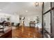Open-concept living room boasting hardwood floors, neutral walls, and lots of natural light at 6624 Lancer Dr, Charlotte, NC 28226