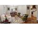 Cozy living space featuring hardwood floors, chic furnishings, and an adjacent dining area at 6624 Lancer Dr, Charlotte, NC 28226
