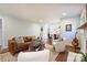 Inviting living room featuring hardwood floors, a modern sofa, and plenty of natural light at 6624 Lancer Dr, Charlotte, NC 28226