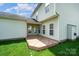 Backyard featuring a wooden deck and green lawn at 6948 Church Wood Ln, Huntersville, NC 28078