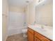 Bathroom with single sink vanity and shower-tub combination with tiled flooring at 6948 Church Wood Ln, Huntersville, NC 28078