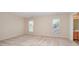Bedroom featuring neutral carpet, natural light, and ensuite bathroom at 6948 Church Wood Ln, Huntersville, NC 28078
