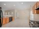 Functional kitchen with tile flooring, wood cabinets, and an adjacent dining area with natural light at 6948 Church Wood Ln, Huntersville, NC 28078