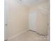 Laundry room with tile floor, wire shelving, and white door at 6948 Church Wood Ln, Huntersville, NC 28078