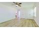 Bright bedroom featuring hardwood floors, a ceiling fan, and spacious closets at 7416 Quail Ridge Dr, Charlotte, NC 28226
