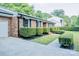 Classic brick home featuring manicured landscaping and a side-entry garage at 7416 Quail Ridge Dr, Charlotte, NC 28226
