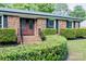 Charming brick home with a manicured front yard and decorative glass front doors at 7416 Quail Ridge Dr, Charlotte, NC 28226