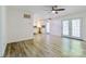 Open concept living area with hardwood floors flowing into kitchen and natural light at 7416 Quail Ridge Dr, Charlotte, NC 28226