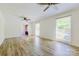 Open living room showcasing hardwood floors, recessed lighting, and lots of natural light at 7416 Quail Ridge Dr, Charlotte, NC 28226