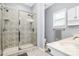 Bathroom with a large walk-in shower, neutral paint, and a small window at 7544 Rolling Meadows Ln, Huntersville, NC 28078