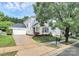 Charming two-story house with a well-manicured lawn and attached two-car garage at 7544 Rolling Meadows Ln, Huntersville, NC 28078
