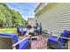 Cozy patio setup with cushioned wicker chairs and a patterned rug for outdoor relaxation at 7544 Rolling Meadows Ln, Huntersville, NC 28078