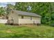 Backyard with a grassy area, wooden deck, and mature trees at 772 Austin Rd, New London, NC 28127