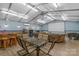 Large recreational space with a projector, seating, bar area, and dining space at 772 Austin Rd, New London, NC 28127
