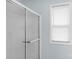 Shower with sliding glass doors and a large window nearby at 772 Austin Rd, New London, NC 28127