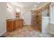 Neutral bathroom with granite vanity, tile floors and walk-in shower with glass surround at 8216 Malibu Pointe Ln, Denver, NC 28037