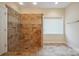 Tiled bathroom features a frameless glass shower with shower niche and accessible hand rail at 8216 Malibu Pointe Ln, Denver, NC 28037