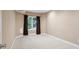 Bedroom featuring neutral walls and carpet and a window with dark brown curtains at 8216 Malibu Pointe Ln, Denver, NC 28037