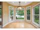 Bright breakfast nook features beautiful lake views from large windows and access to a deck at 8216 Malibu Pointe Ln, Denver, NC 28037