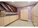 Spacious storage room with wall cabinets and wood wine rack at 8216 Malibu Pointe Ln, Denver, NC 28037