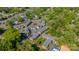 Aerial view of a well maintained apartment complex surrounded by lush trees and ample parking at 862 Mcalway Rd, Charlotte, NC 28211