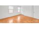 Bedroom featuring hardwood floors, two windows, and neutral wall color at 862 Mcalway Rd, Charlotte, NC 28211