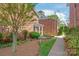 Charming brick exterior featuring a well-manicured lawn and beautiful landscaping at 862 Mcalway Rd, Charlotte, NC 28211
