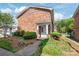 Charming brick home featuring a covered front entrance with white columns and well-maintained landscaping at 862 Mcalway Rd, Charlotte, NC 28211